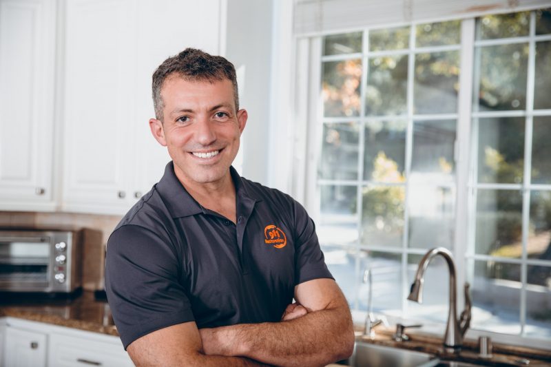 sewage backup cleanup technician in home