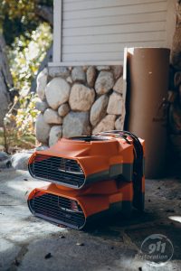 mold removal equipment on front porch of house